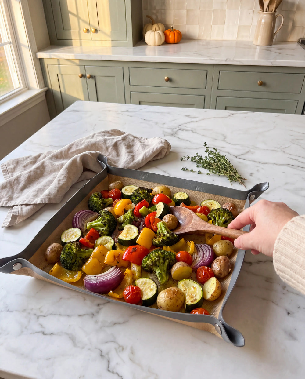 Stirring roasted vegetables on TrayFold